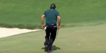 Watch: Phil Mickelson chases after, hits moving ball on green